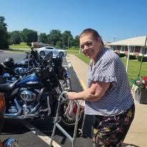 Community member visiting with riders