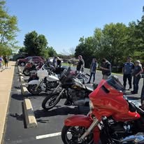 Motorcycles and participants gathered at a community charity event